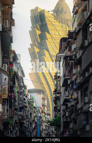 A vertical shot of grand Lisboa Macau architecture from the slums in Macau city, China Stock Photo