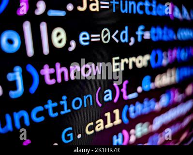 Error text in computer code displayed on pixelated screen with colorful words on a dark background Stock Photo