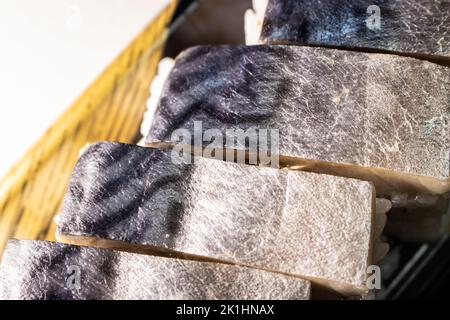 Saba Sushi (Saba Oshizushi, Mackerel Pressed Sushi). Oshi Zushi is a form of sushi which made by compressing sushi rice with fish and toppings Stock Photo