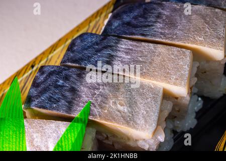 Saba Sushi (Saba Oshizushi, Mackerel Pressed Sushi). Oshi Zushi is a form of sushi which made by compressing sushi rice with fish and toppings Stock Photo