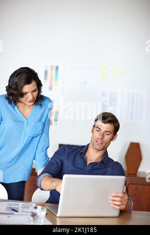 Am I on the right track. two colleagues working together on a project. Stock Photo