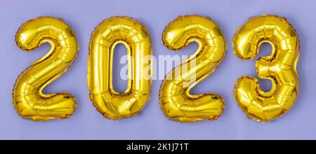 Happy New year 2023 celebration. Foil balloons numeral 2023 .Flat lay Stock Photo
