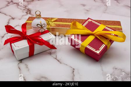 Christmas gift boxes isolated on marble table. Christmas decorations. Stock Photo
