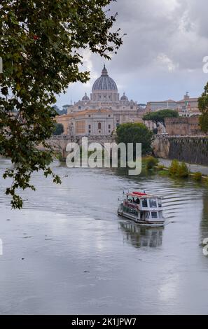 Tiber River in Rome, Italy: view of bridge Sant'Angelo and on background Saint Peter's Basilica. Stock Photo