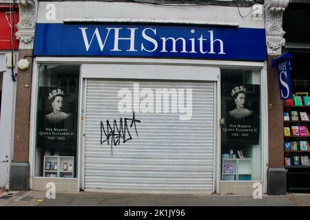 WH Smith shop window displays and closed signs in muswell hill on 19th september 2022 for the Queen Elizabeth 2 funeral tribute and commemoration Stock Photo