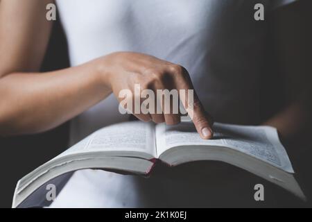 Religious young woman praying to God in the morning, spirtuality and religion, Religious concepts Stock Photo