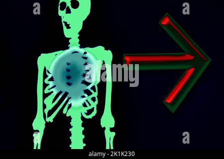 Halloween green funny skeleton with red arrow indicating the direction on black Stock Photo
