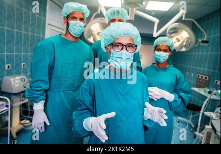 Exhausted surgeons at the emergency room as a sign of stress and overwork Stock Photo