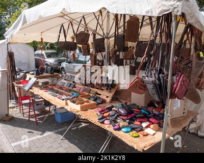 Doel, Belgium, 21 August 2022, Market stall with leather goods Stock Photo