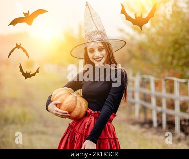 Portrait of teenage girl in witch hat Stock Photo