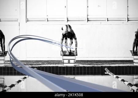 Grey line design against swimmers ready to plunge Stock Photo