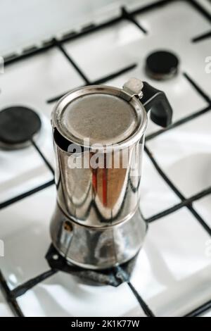 Metal coffee maker for brewing espresso coffee on the stove. Alternative brewing methods. High quality photo Stock Photo