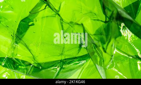 Plastic green bag texture background. Crumpled polyethylene texture. Waste recycle concept. . High quality photo Stock Photo