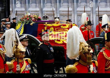 LONDON, ENGLAND - SEPTEMBER 19: The coffin of Queen Elizabeth II with the Imperial State Crown resting on top i proceeds towards Westminster Abbey on September 19, 2022 in London, England. Elizabeth Alexandra Mary Windsor was born in Bruton Street, Mayfair, London on 21 April 1926. She married Prince Philip in 1947 and ascended the throne of the United Kingdom and Commonwealth on 6 February 1952 after the death of her Father, King George VI. Queen Elizabeth II died at Balmoral Castle in Scotland on September 8, 2022, and is succeeded by her eldest son, King Charles III. (Photo by Tristan Fewin