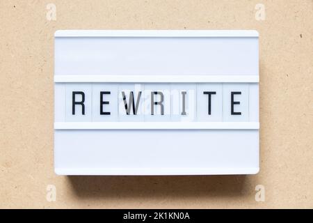 Lightbox with word rewrite on wood background Stock Photo