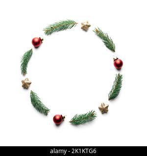 Creative Christmas background with Christmas balls, pine twigs and golden stars decorations on white background. Flat lay, top view, copy space Stock Photo