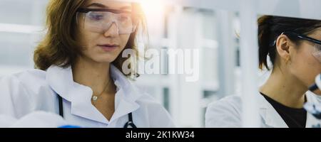 Close up portrait of female researcher, medical scientist or doctor in laboratory Stock Photo
