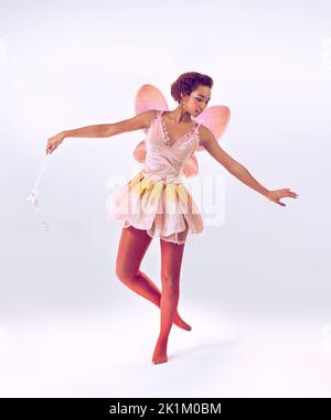 Dance of the fairy. A full length shot of a cute fairy dancing. Stock Photo