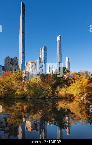Midtown Manhattan view of Central Park in Fall with Billionaires' Row skyscrapers. New York City Stock Photo