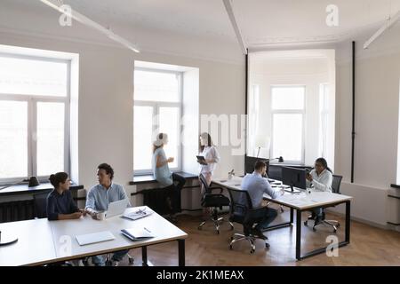 Contemporary loft office space with multiethnic business team Stock Photo