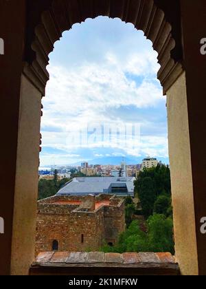 view of the city from the arch of Alcazaba de Malaga, cloudy day, Andalusia, Spain. High quality photo Stock Photo
