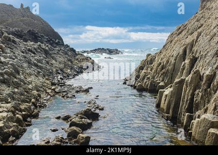 Coastal Cliffs Formed By Columnar Basalt At Low Tide Stock Photo - Alamy