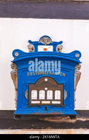 Public blue mailbox on a wall in germany Stock Photo