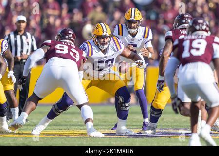 LSU Tigers offensive lineman Charles Turner (69) snaps the ball to quarterback Jayden Daniels (5) against the Mississippi State Bulldogs, Saturday, Se Stock Photo