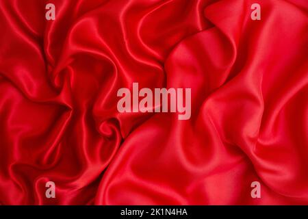 Satin vs silk textures, red fabric quality comparison Stock Photo