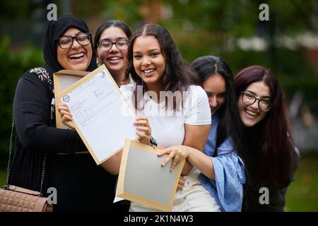 2022 A Level results day at in South Manchester. Celebrating their results success at Whalley Range High School. Stock Photo