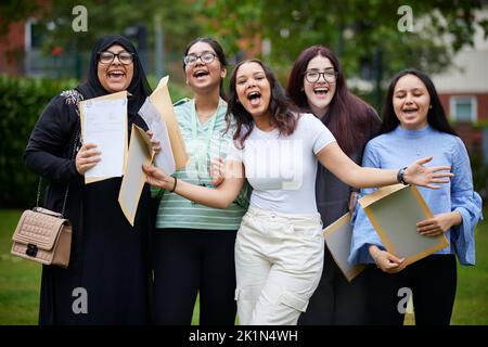 2022 A Level results day at in South Manchester. Celebrating their results success at Whalley Range High School. Stock Photo