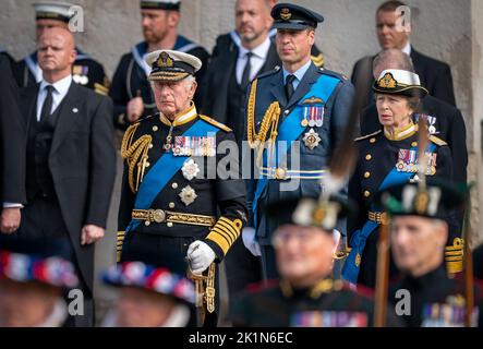 King Charles III, the Prince of Wales and the Princess Royal look on as the State Gun Carriage carrying the coffin of Queen Elizabeth II arrives at Wellington Arch during the Ceremonial Procession following her State Funeral at Westminster Abbey, London. Stock Photo