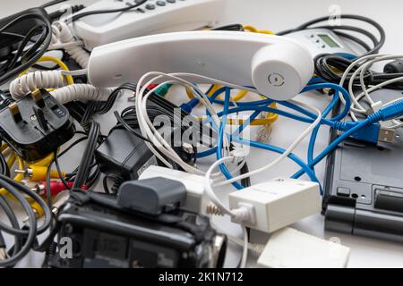 A heap of outdated consumer electronic equipment for waste disposal. Stock Photo