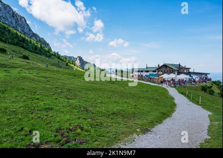Aschau, Bavaria, Germany - July 14, 2020: Tourists Visiting The Steinlingalm In Front Of The Kampenwand, A Mountain In Bavaria, Germany Stock Photo