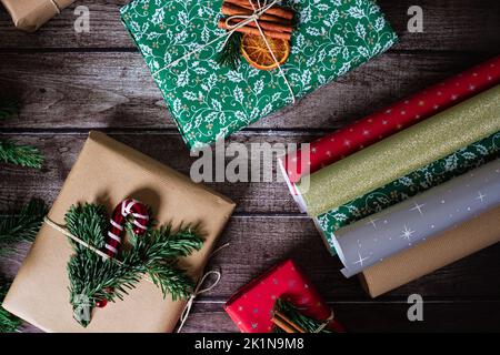 Close-up of a roll of orange wrapping paper, scissors, pruning