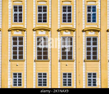 Architectural detail with the windows of an old building. Old vintage architecture in the center of Prague, Czech Republic. Seamless pattern backgroun Stock Photo