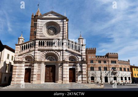 Grosseto , Italy the cathedral of S. Lorenzo frontage decorated , in the background part of Piazza Dante the main square of the city  with Palazzo Ald Stock Photo