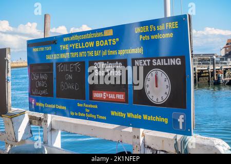 Sign for Boat Trips, Whitby Harbour, North Yorkshire, England, United Kingdom. Stock Photo