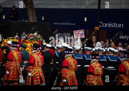 London, UK. 19th Sep, 2022. A sign is held up that reads 'Ma'am Thank You Good'Bye' as The coffin of Queen Elizabeth II drawn on gun carriage passes through Whitehall during the state funeral of Queen Elizabeth II on 19th September 2022. Credit: Lucy North/Alamy Live News Stock Photo