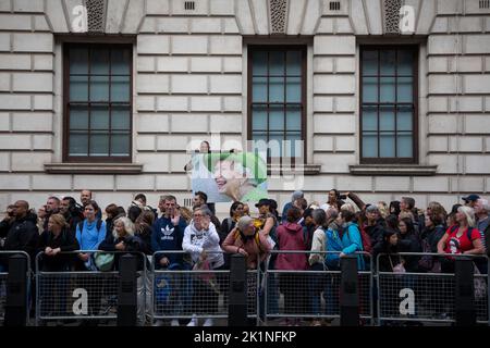 London, England. 19th September, 2022. A picture of her Majesty, Queen Elizabeth II is held up on one of the biggest events the country has ever seen. The State Funeral of the Queen took place in London and Windsor. Credit: Kiki Streitberger / Alamy Live News Stock Photo