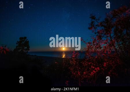 Moonset and stars at Point Betsie Lighthouse, Michigan, USA Stock Photo