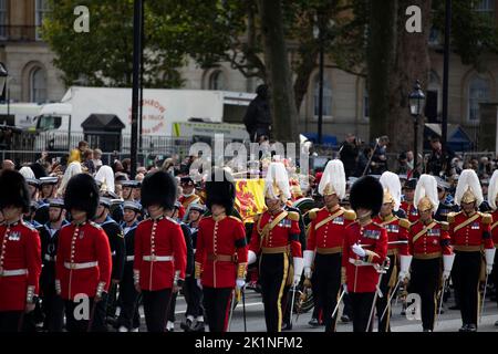 London, UK. 19th Sep, 2022. The coffin of Queen Elizabeth II drawn on gun carriage by members of the Royal Navy passes through Whitehall during the state funeral of Queen Elizabeth II on 19th September 2022. Credit: Lucy North/Alamy Live News