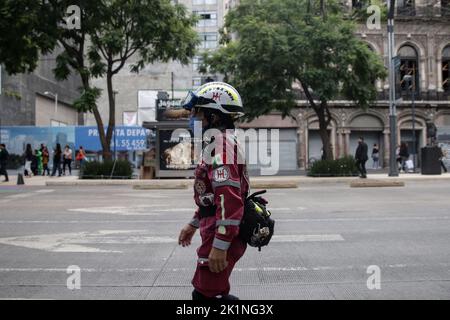 Mexico City, Mexico. 19th Sep, 2022. A rescuer is seen after an earthquake in Mexico City, Mexico, on Sept. 19, 2022. An earthquake with a magnitude of 7.4 shook Mexico on Monday, according to preliminary data, with further details unavailable at the moment. Credit: Francisco Canedo/Xinhua/Alamy Live News Stock Photo