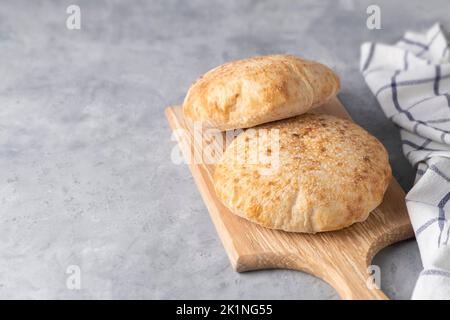 Homemade pita bread on neutral background with copy space Stock Photo