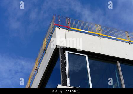 fall protection on the flat roof of a shell of a school building Stock Photo