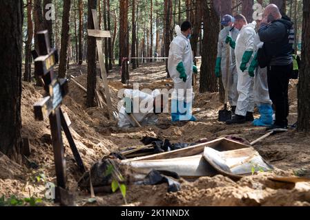 September 19, 2022, Izium, Kharkiv region, Ukraine: On the outskirts of Izium, mass graves with more than 400 bodies of civilians, who died as a result of Russian occupation were found when the city was liberated by Ukrainian armed forces a week earlier. Exhumations of bodies, buried in these graves are performed since then. 200 bodies of civilians were already exhumed. (Credit Image: © Danylo Antoniuk/ZUMA Press Wire) Stock Photo