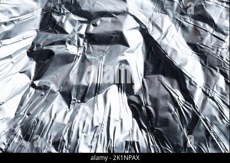 Polished crumpled metal foil macro close up view Stock Photo
