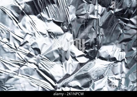 Metal foil background macro close up view. Texture of steel backdrop Stock Photo