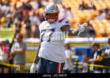 New England Patriots offensive tackle Isaiah Wynn (76) runs on the field  during the first half of an NFL football game against the Green Bay  Packers, Sunday, Oct. 2, 2022, in Green