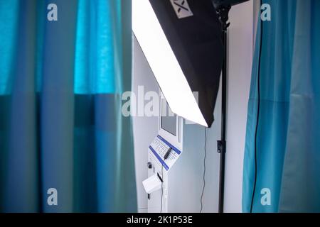 The light and photo shooting setup in the cabin seen from behind the curtains. The selfie studio opened in Moda district of Kadikoy district of Istanbul is in high demand because it is out of the ordinary. Sally and Jong South Korean couple brought this business, which is currently popular in South Korea, to life in Istanbul with an entrepreneurial spirit. Sally said that they would like to open their second branch in Izmir in the future. Customers have fun moments by entering the cabins using different concepts such as glasses, hats and accessories in the business and giving different poses. Stock Photo